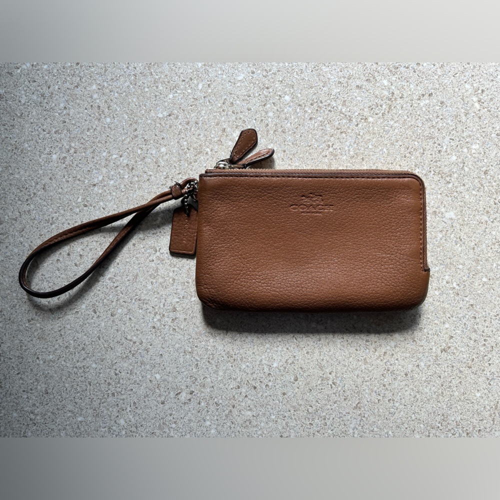 Coach branded light brown wristlet wallet